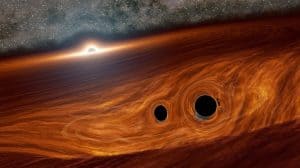 ثقب أسود فائق الكتلة يتيح رصد تصادم بين ثقبين أسودين صغيرين